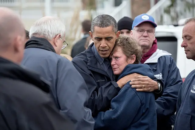 President Barack Obama hugs Donna Vanzant, the owner of North Point Marina, as he tours damage from Hurricane Sandy in Brigantine, N.J. on October 31st.